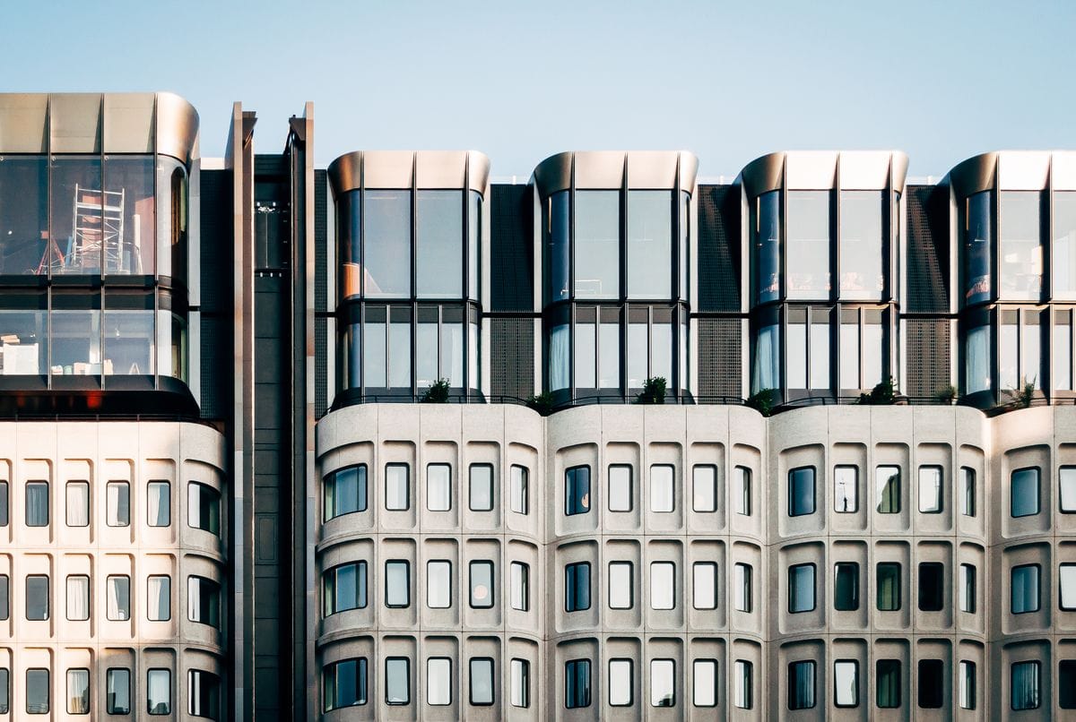 White concrete building facade with repeating windows