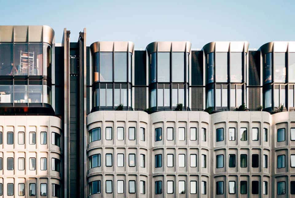 White concrete building facade with repeating windows